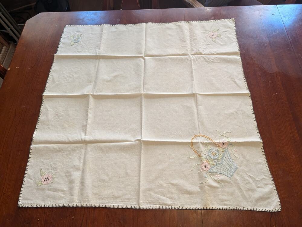 vintage hand-embroidered cotton-linen tablecloth features a charming floral...